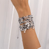 Set De 2 Pulseras Tejidas Con Dije De Estrellas + Aretes